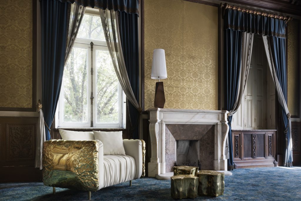 Intimate Luxury: Gold finishes in the Imperfectio Armchair and Eden Center-Table. Feel Lamp in the background on the fireplace.