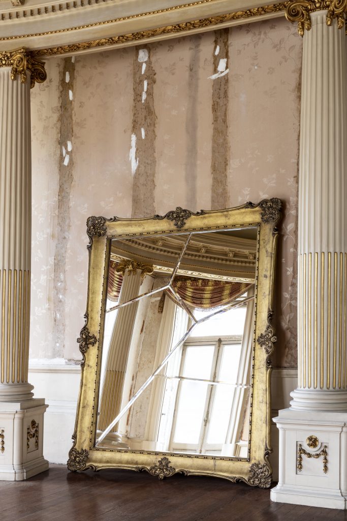 Intimate Luxury - Large mirror in gold finishes.