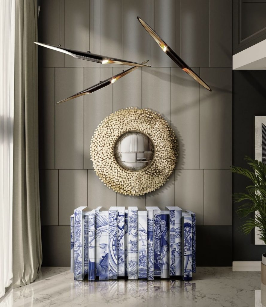 blue and white sideboard and gold mirror