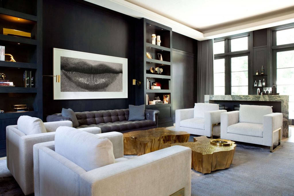 living room with golden coffee table, and white armchairs