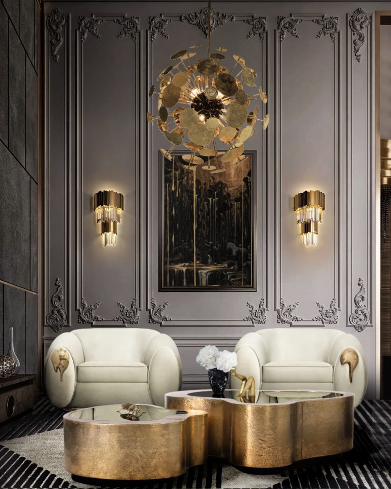 living area with a gold center table and white armchairs